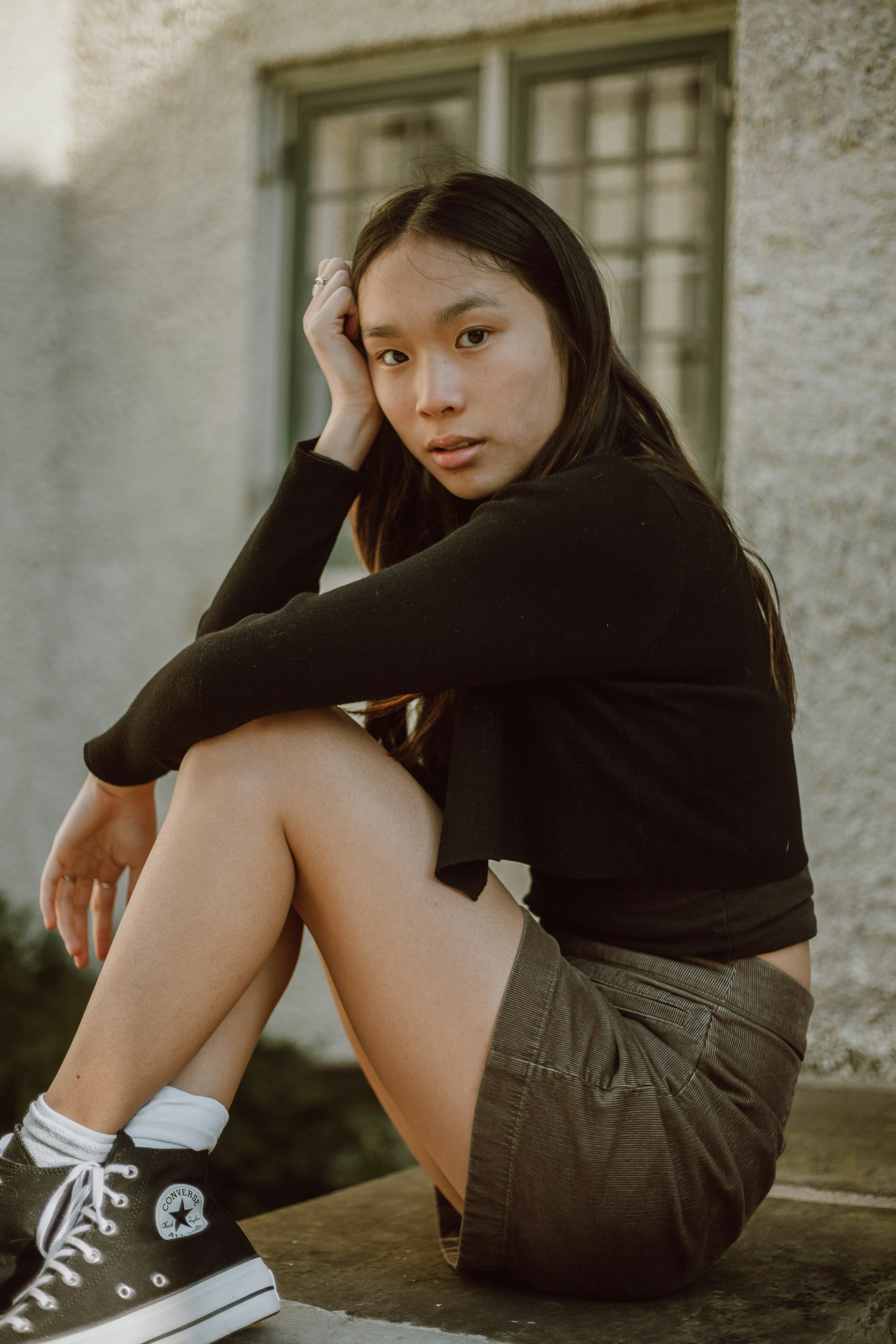 Candid Asian Girl in Jeans and White Converse